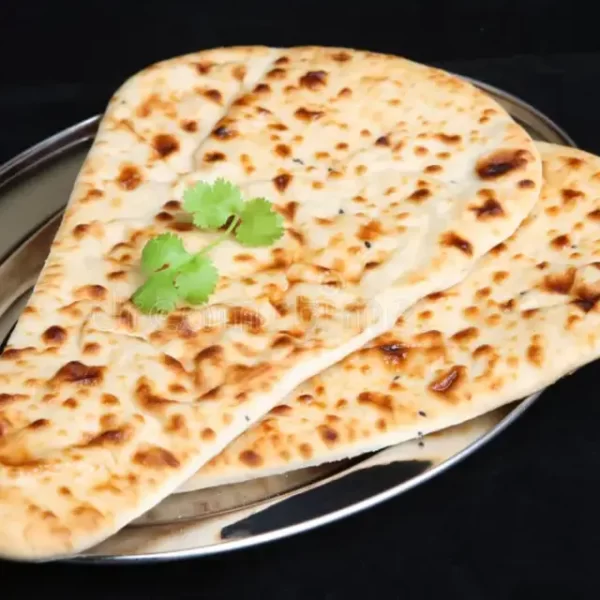 1732608508-indian-food-naan-bread-isolated-stainless-steel-platter-33630379